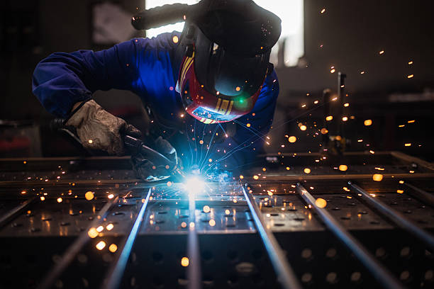 istock Metalworker Grinding Iron Fence with Sparks 2241331767