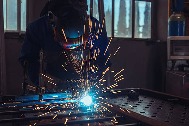 istock Metalworker Grinding Iron Fence with Sparks 2241331926