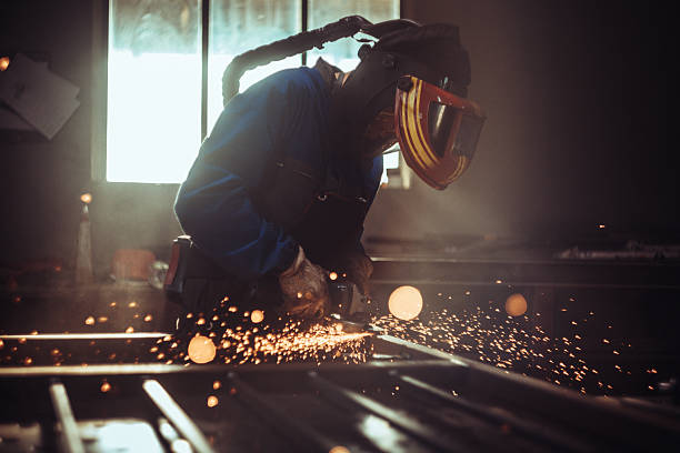 istock Metalworker Grinding Iron Fence with Sparks 2241332911