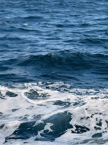 istock Churning Blue Sea Water with White Foam and Ripples 2241335204