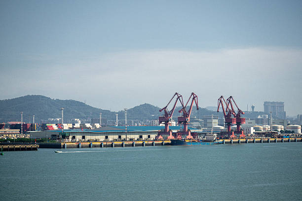 istock A Busy Port Terminal with Red Cranes and Container Ships in the Background 2241336684