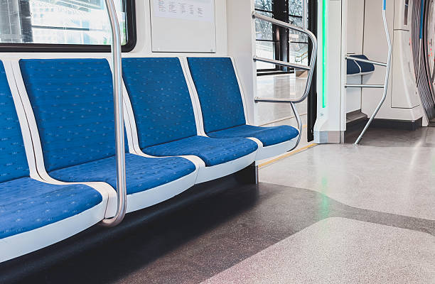 istock Empty blue seats inside a modern subway train with clean interior and bright lighting, showing public transportation, urban mobility, and daily commuting in a comfortable environment 2241339151