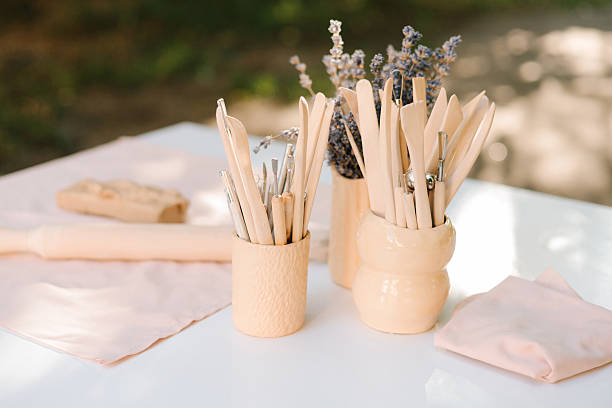 istock Pottery shaping instruments provide precision for clay sculpting. Clay sculpting tools in ceramic cups. Clay sculpting tools arranged in ceramic cups highlight the artistry of pottery. 2241341115