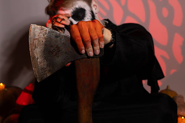 Man with knife in hand, intense expression, dark alley background.