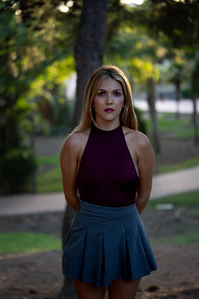 Young woman posing outdoors in park