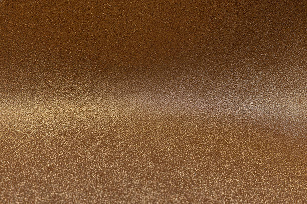 istock Golden glitter surface with central focus and bright stripe creating elegant festive glowing texture 2241354393