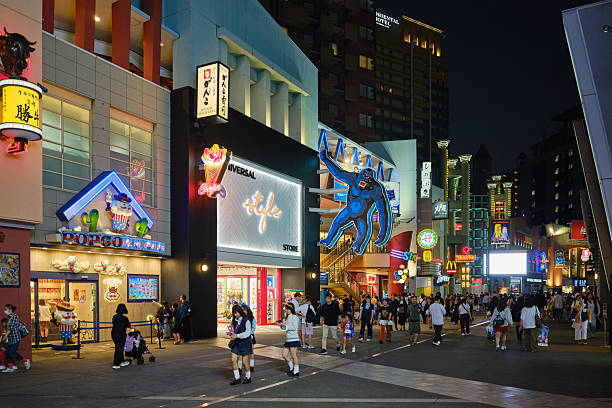 Osaka, Japan - October 14, 2025: Crowds of people at night in the Universal Citywalk area of Osaka, Japan.