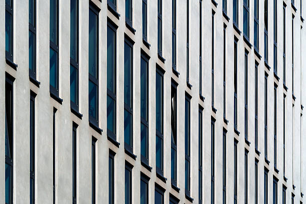 istock Modern office building facade with geometric white vertical panels and color tones in rhythmic pattern 2241355978