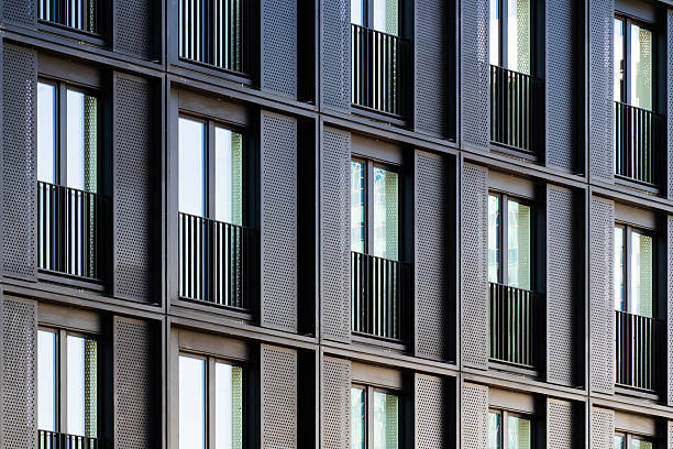 istock Modern residential building facade with repeating balconies and geometric grid pattern in contemporary architectural design 2241356046
