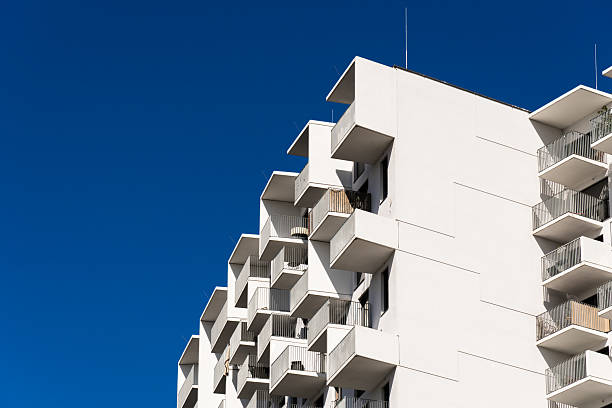 istock Modern residential architecture with repeating balconies and geometric facade under bright clear blue sky background 2241357073