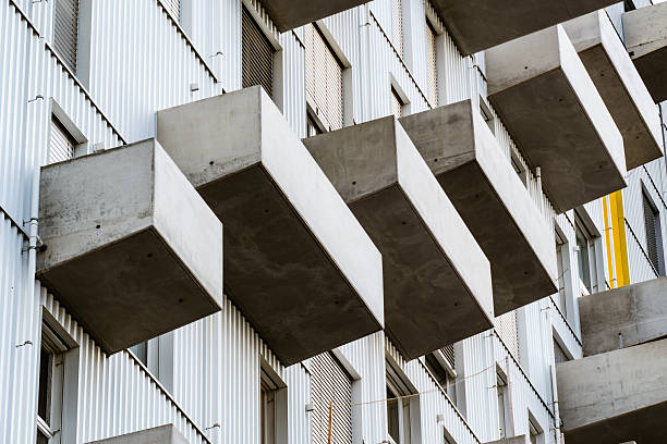 architecture, residential, building, balconies, concrete, facade, modern, housing, structure, design, geometry, pattern, repetition, symmetry, exterior, urban, contemporary, construction, detail, minimalism, elevation, innovation, apartment, texture, rhythm, perspective, material, city, development, modernism, architectural, environment, living, housing, contrast, form, depth, light, structure, design, architecture, composition