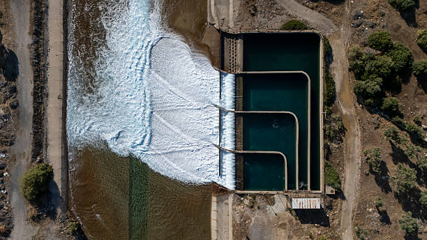 Coal Power Plant Near Coastline and Mountains