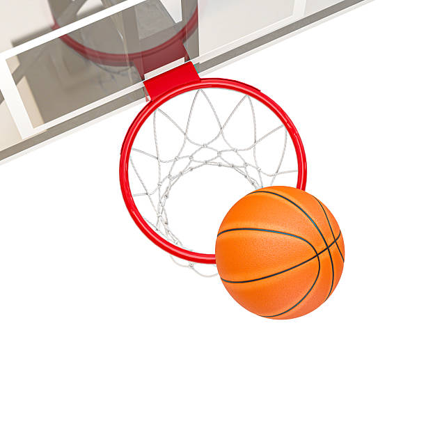istock Basketball falling through hoop achieving success against white 2241363676