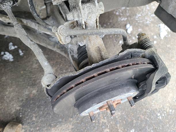 istock Car without wheel and lift up by hydraulic, waiting for tire replacement 2241365425