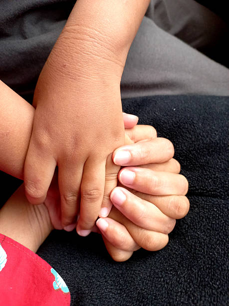 istock Intertwined Hands A Symbol of Connection and Support 2241367644