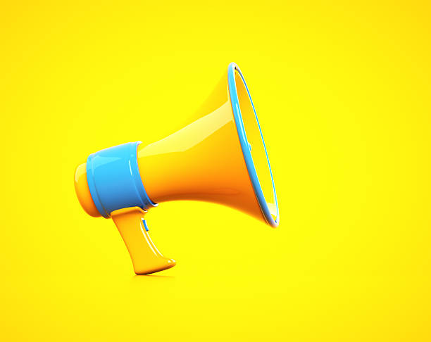 istock Vibrant megaphone resting on a bright yellow background ready for announcements 2241367848