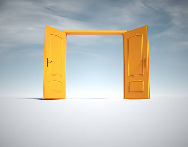 istock Open yellow doors in a bright, simple space representing new opportunities and choices in life 2241367991