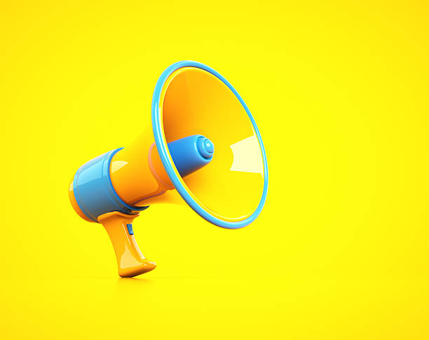 istock Vibrant megaphone resting on a bright yellow background ready for announcements 2241368086