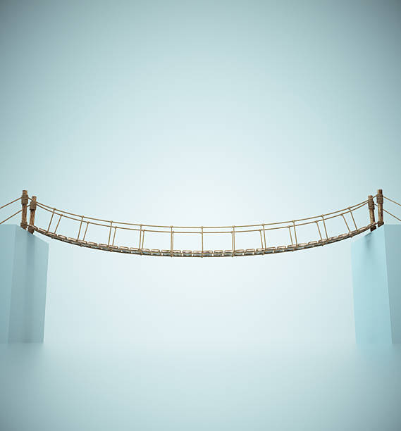 istock Suspension bridge connecting two pillars over a misty landscape at dawn, showcasing architectural design and nature 2241368298