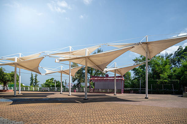 istock Modern Shade Canopy Structures in an Outdoor Recreation Area with Open Sky and Greenery 2241368670
