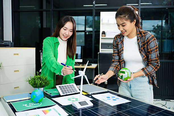 istock Discussion among businesspeople on the latest developments in solar cell panel technology and Solar Energy Environment city Concept. 2241371616