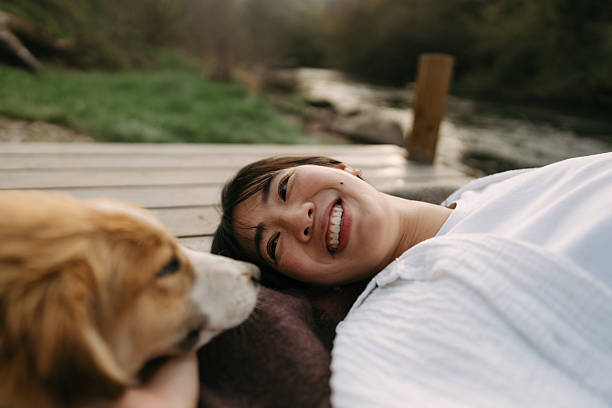 istock Relaxing with my best friend by the river after a long week 2241371843