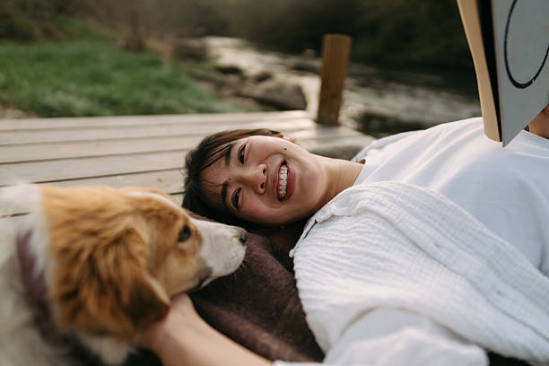 istock Relaxing with my best friend by the river after a long week 2241371882