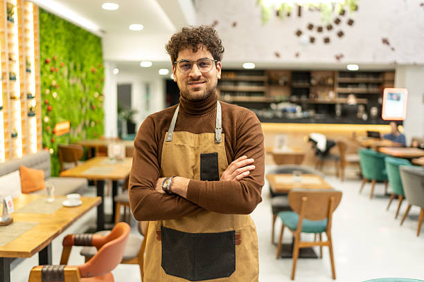 istock Confident man small business owner standing in restaurant 2241378456