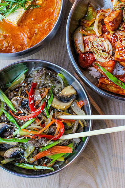 Asian cuisine. Wok, rice, noodles. Top view.