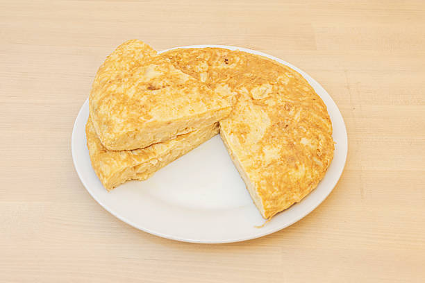 potato omelet with a broccoli dish in the background