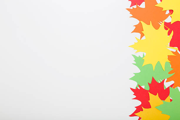 istock Created colorful different paper leaves from application paper on light gray table background. Closeup. Autumn decoration. Empty place for text. Top down view. 2241384931
