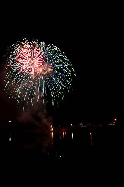 istock Large multicolored spread of fireworks streaming towards the sky 2241391588