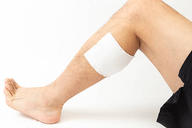 istock A man's leg with a compress on it, white background 2241396358