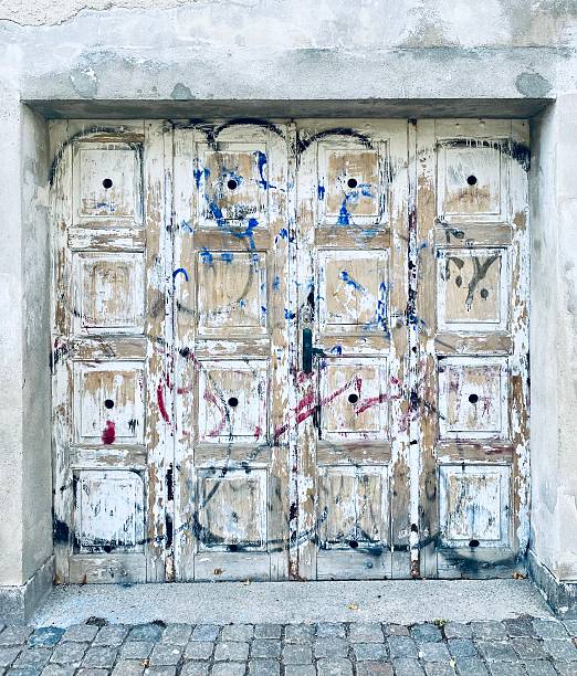 Old wooden door in deserted building copenhagen.