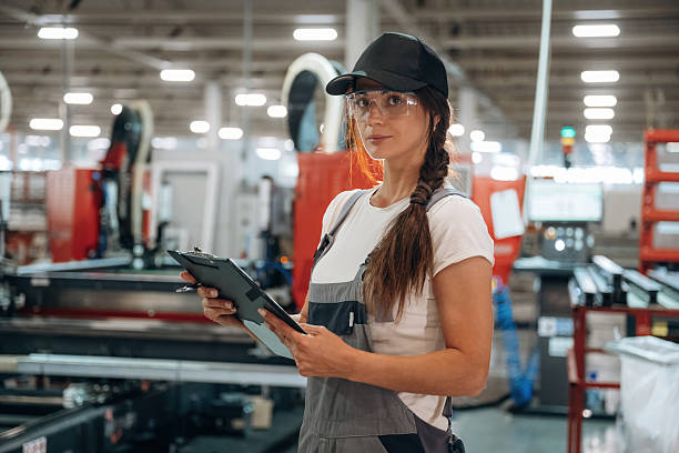 istock Notepad is in hands. Woman is in the window making factory 2241399141