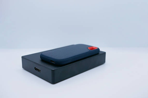 istock Two External SSD and HDD Drives on White Background 2241400260