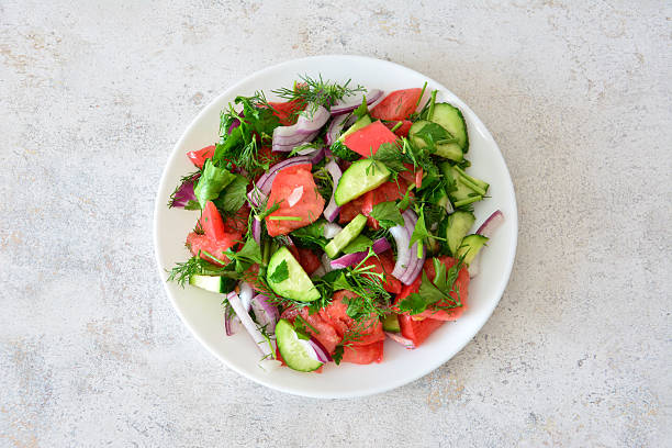 istock Fresh Summer Salad with Tomatoes, Cucumbers and Red Onion cut out 2241400435