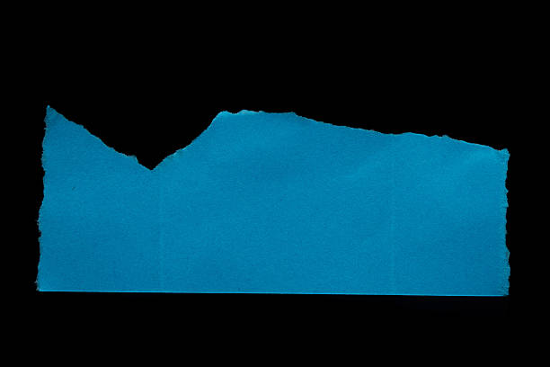 istock Ripped blue paper torn edges isolated on black 2241402811