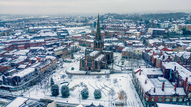 istock Town Centre With Snow Covered Church And Rooftops 2241402838