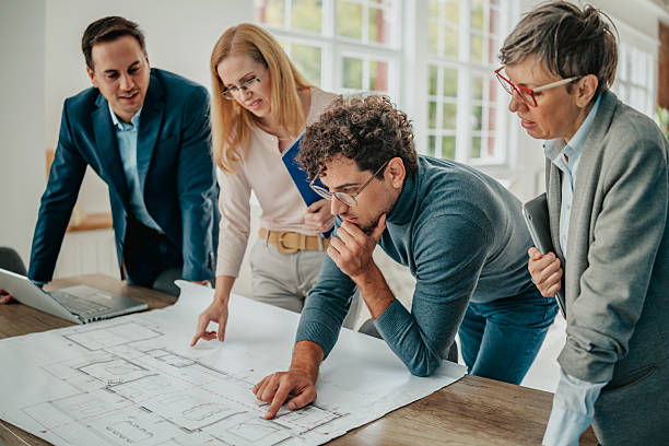 istock Business professionals collaborating on strategic plans in a modern office setting 2241404093