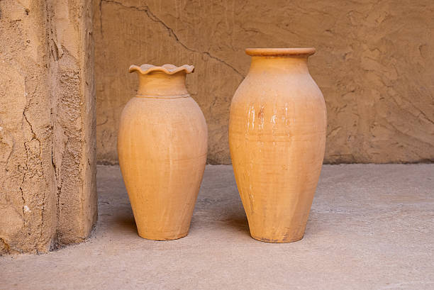 istock Clay Pots Against Ancient Wall in Dubai Heritage Village 2241404686