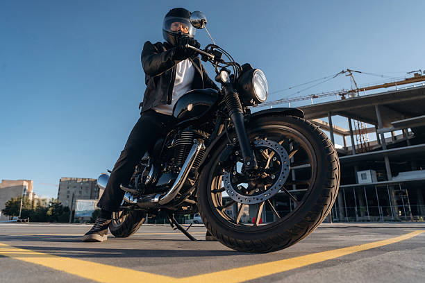 istock Unrecognizable in the protective hat. Man is outdoors with his motorcycle 2241405924