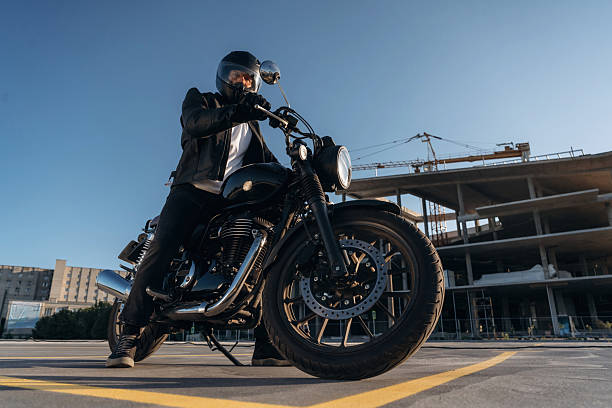 istock Unrecognizable in the protective hat. Man is outdoors with his motorcycle 2241405935