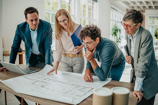istock Business professionals engaged in collaborative planning in a bright modern office space 2241406829