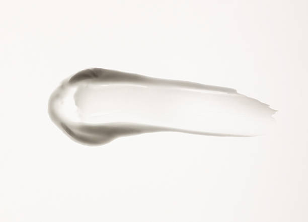 istock white cream smear, cosmetics textures on the white background 2241408922