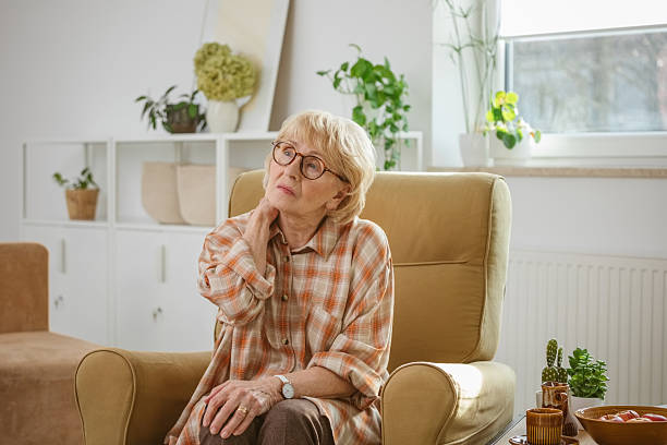 istock Sad senior woman suffering neckache 2241410776
