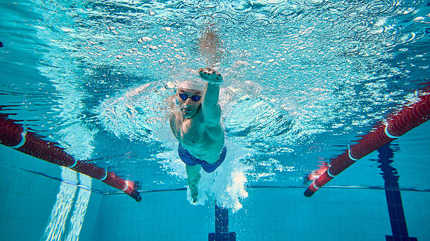 istock Swimmer underwater freestyle stroke captured with bubbles and intensity 2241412994