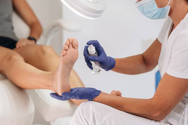 istock Procedure is in progress. Podiatrist with client in clinic 2241413350