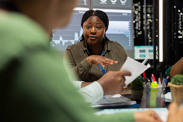 istock Financial experts team meeting after hours to discuss data forecasts 2241414756