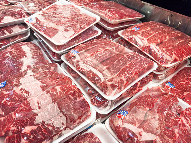 Beef stteak packages in a market display in butcher shop
